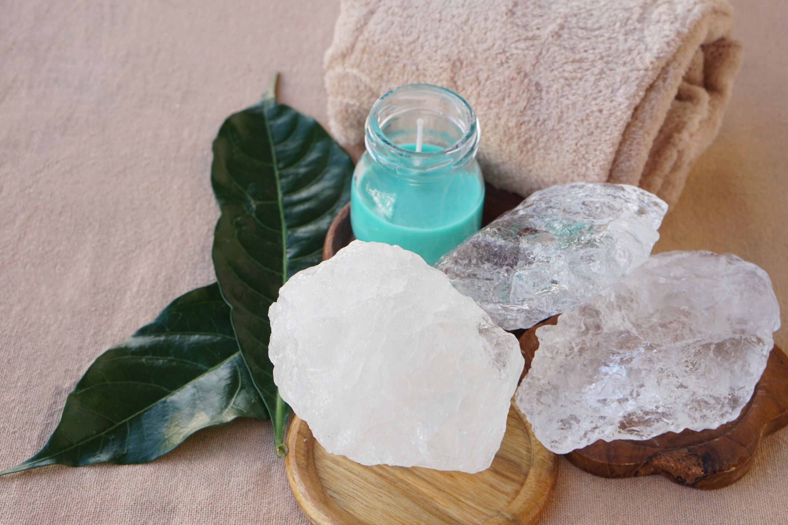 Spa stones and candle arranged in a peaceful wellness setting